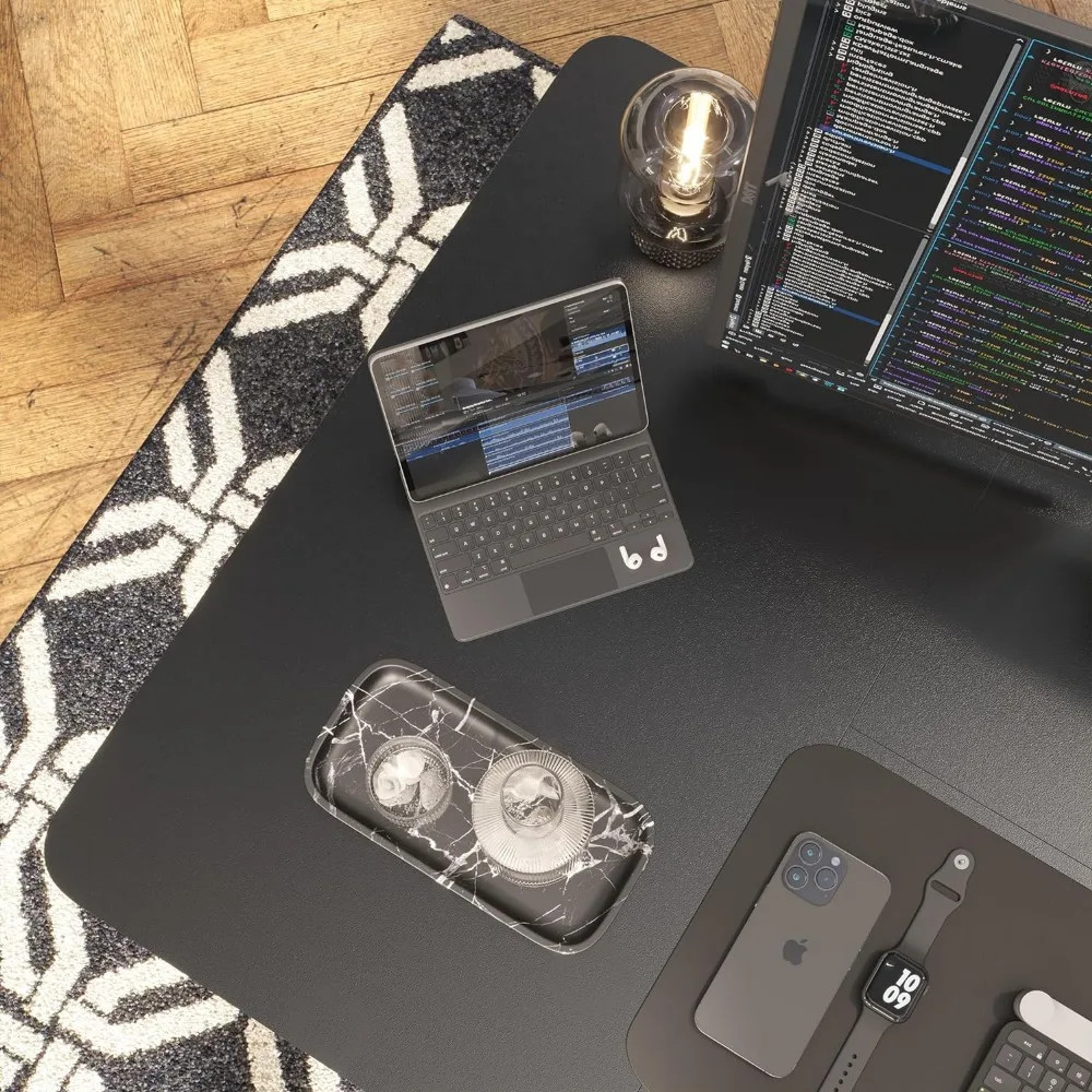 Desk with laptop, phone, monitor, and cable management